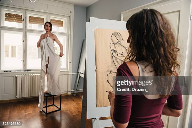 artists in atelier charcoal drawing semi nude model - artists model stock pictures, royalty-free photos & images