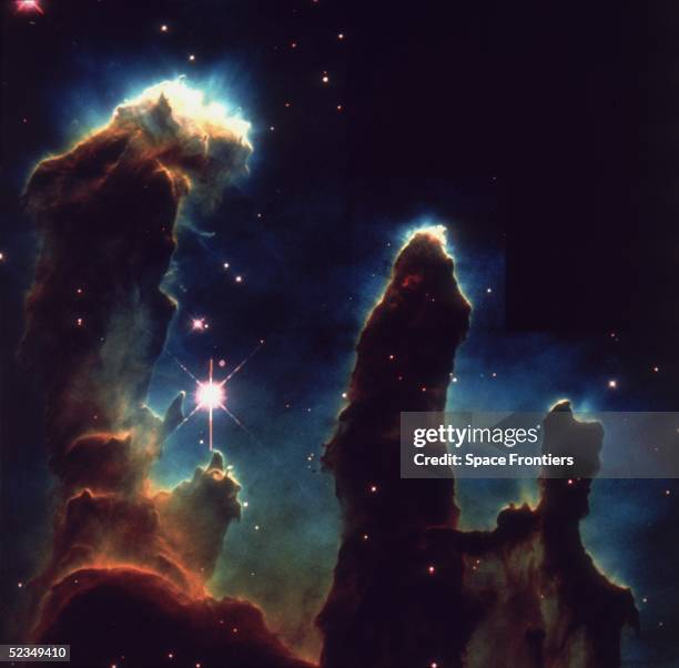 An image taken via Hubble telescope entitled Pillars of Creation, depicting gaseous pillars in M16, the Eagle Nebula. These columns of hydrogen and...