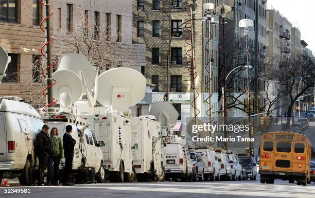 Media trucks are seen outside New York-Presbyterian Hospital/Columbia University Medical Center where former President Bill Clinton is undergoing...