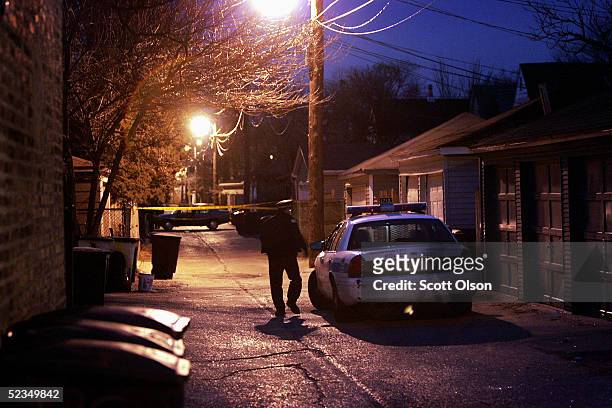 Chicago Police secure the area around a residence on the city's northwest side believed to be the home of suspected murderer Bart Ross March 10, 2005...