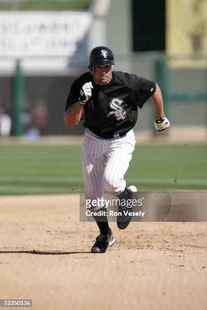 Scott Podsednik of the Chicago White Sox runs the bases during the spring training game against the Colorado Rockies at Tucson Electric Park on March...
