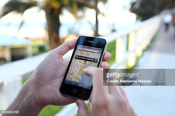 woman using her iphone - sydney map stock pictures, royalty-free photos & images