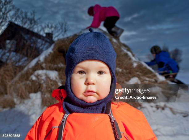 boy (18 months) in snowsuit - strobe light bildbanksfoton och bilder