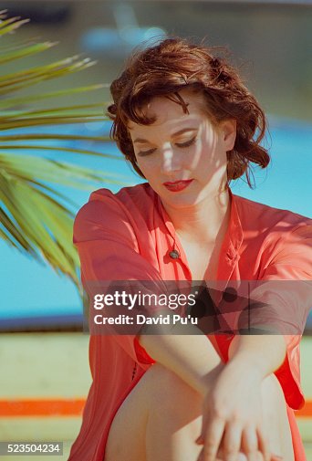 Woman Sitting on the Beach