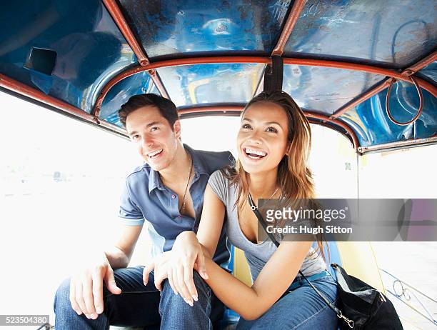 tourist couple in bangkok. thailand. - hugh sitton stockfoto's en -beelden