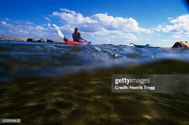 kayaker in stockholm archipelago - kayaking stockholm stock pictures, royalty-free photos & images