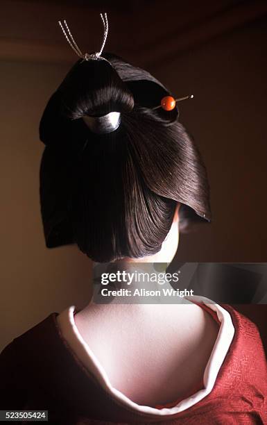 geisha with hair in bun - geisha japan stock pictures, royalty-free photos & images