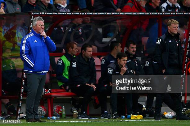 Guus Hiddink interim manager of Chelsea and Eddie Howe Manager of Bournemouth look on during the Barclays Premier League match between A.F.C....