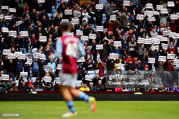 Jack Grealish of Aston Villa looks on as Aston Villa supporters hold signes reading "Proud history, What future?"during the Barclays Premier League...