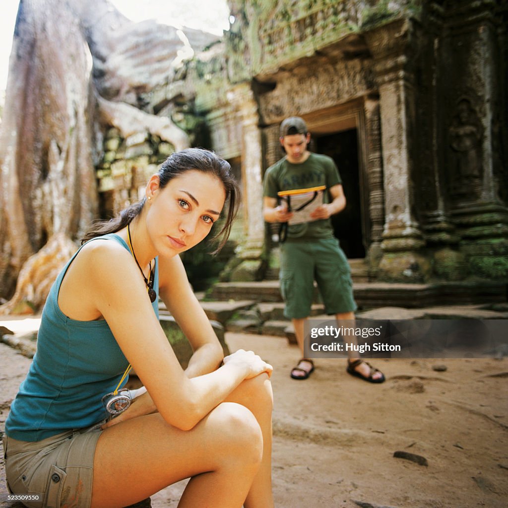 Tourist Couple with Map at Temple