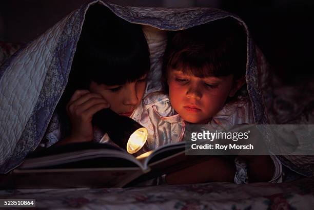 friends reading together in bed - sleepover bildbanksfoton och bilder