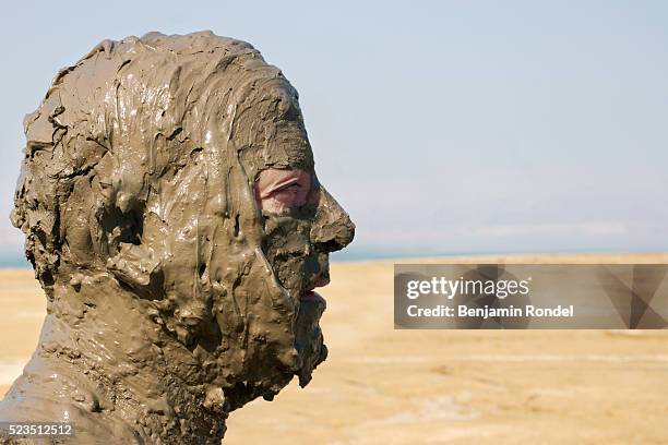 man covered in mud - people covered in mud stock pictures, royalty-free photos & images