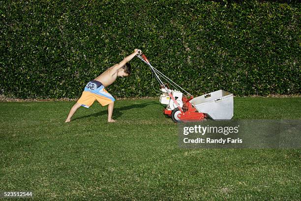 boy mowing the lawn - つまらない仕事 ストックフォトと画像