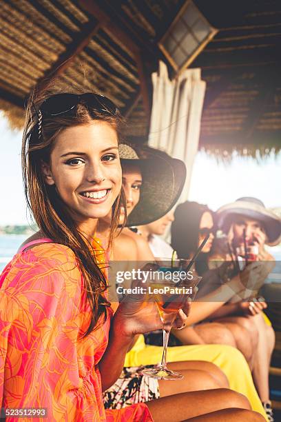 group of friends toasting at birthday party - beach cocktail party stock pictures, royalty-free photos & images