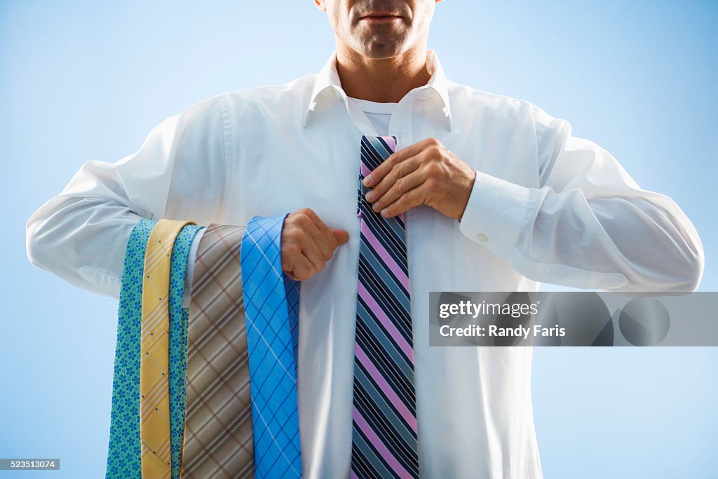 Businessman Selecting Tie