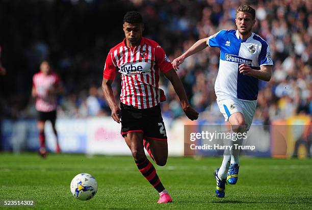 Ollie Watkins of Exeter City is tackled by Lee Mansell of Bristol Rovers during the Sky Bet League Two match between Bristol Rovers and Exeter City...