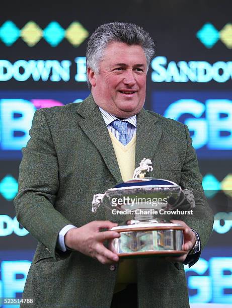Paul Nicholls celebrates after being crowned Champion Trainer at Sandown racecourse on April 23, 2016 in Esher, England.