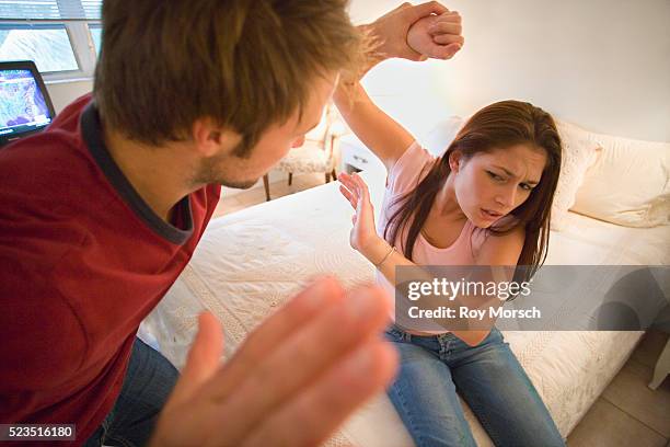 couple in violent argument - domestic violence men stock-fotos und bilder