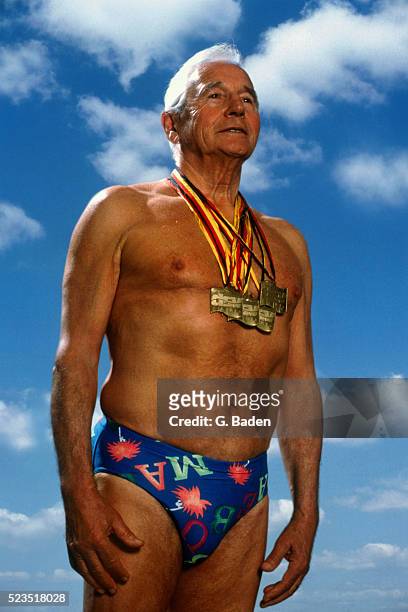 senior man wearing sports medals - medalist bildbanksfoton och bilder