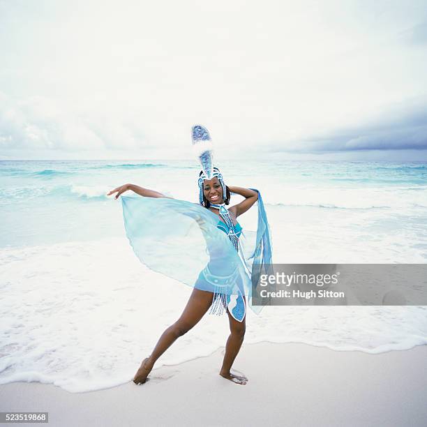 girl in elaborate costume at the beach - show girls stock pictures, royalty-free photos & images