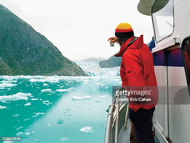 man photographing glacier from boat - camera boat stock pictures, royalty-free photos & images