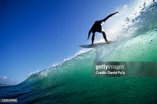 surfer on top of wave - surfbrett stock-fotos und bilder