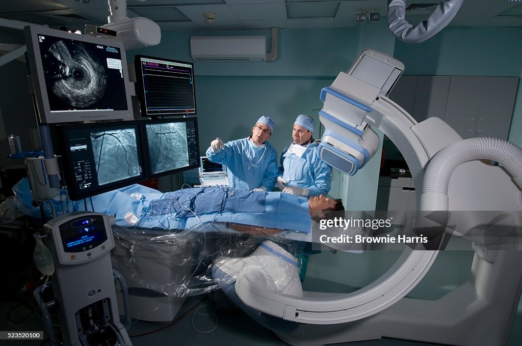Doctors reviewing patient tests in a Cardiac Catheterization Laboratory