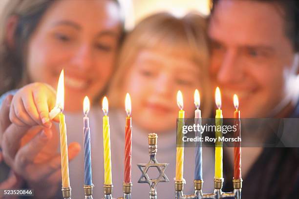 family lighting menorah - menorah lights stock pictures, royalty-free photos & images