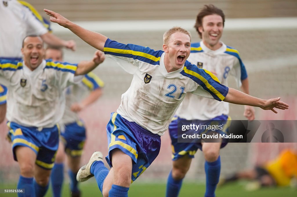 Enthusiastic Soccer Player Cheering