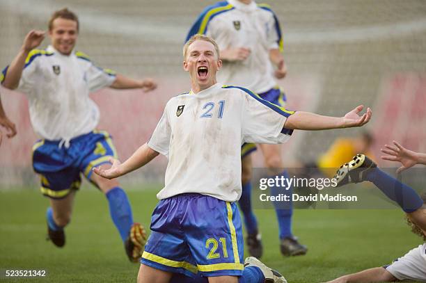 enthusiastic soccer player cheering - football team running stock pictures, royalty-free photos & images