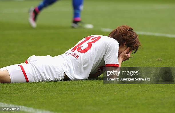 Yuya Osako of Cologne covers his face after missing a chance during the Bundesliga match between 1. FC Koeln and SV Darmstadt 98 at...