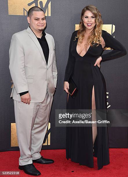 Personalities Jo Rivera and Kailyn Lowry arrive at the 2016 MTV Movie Awards at Warner Bros. Studios on April 9, 2016 in Burbank, California.