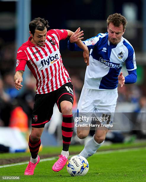 Alex Nicholls of Exeter City is tackled by Chris Lines of Bristol Rovers during the Sky Bet League Two match between Bristol Rovers and Exeter City...