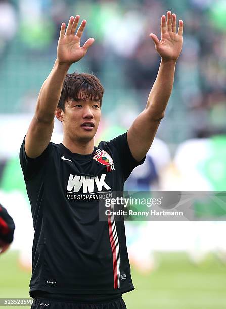 Jeong-Ho Hong of Augsburg applauds the fans after the Bundesliga match between VfL Wolfsburg and FC Augsburg at Volkswagen Arena on April 23, 2016 in...