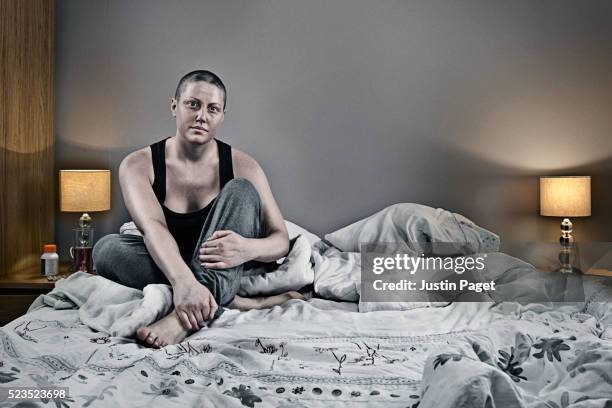 cancer patient sitting on bed - female victim stock pictures, royalty-free photos & images