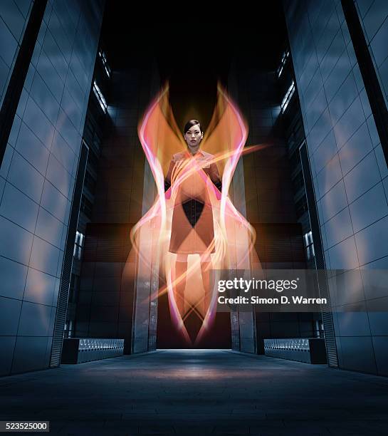 woman hovering between buildings - heldin stockfoto's en -beelden