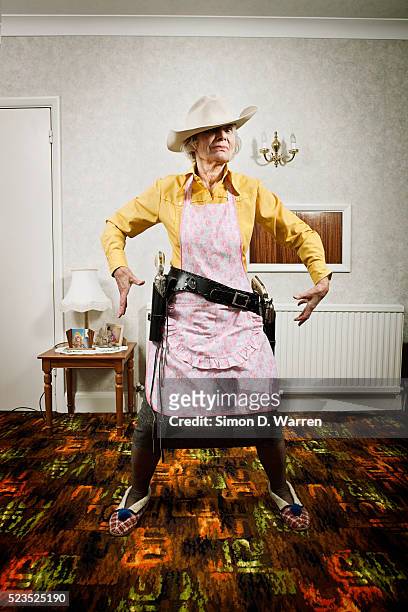 senior woman dressed as cowgirl - holster stock pictures, royalty-free photos & images