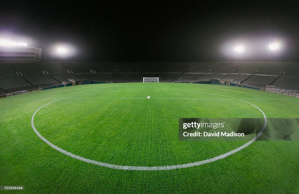 Soccer Ball in Empty Stadium