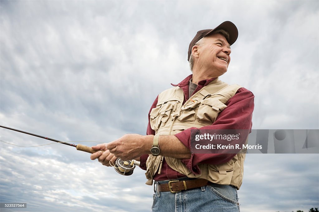 Man fly-fishing at Sebago Lake