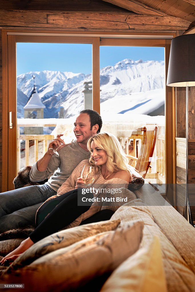 Couple relaxing in ski lodge