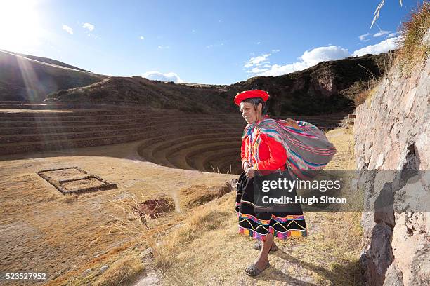 woman at the moray archaeological site, near cusco. peru - moray inca ruin stock pictures, royalty-free photos & images