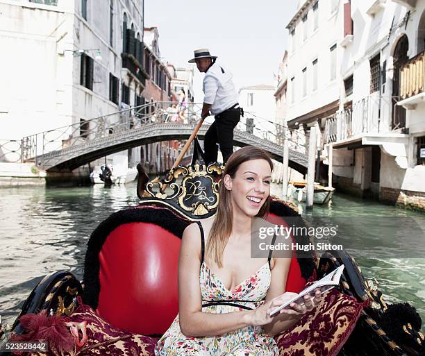 female tourist in gondola , venice, italy - hugh sitton - fotografias e filmes do acervo