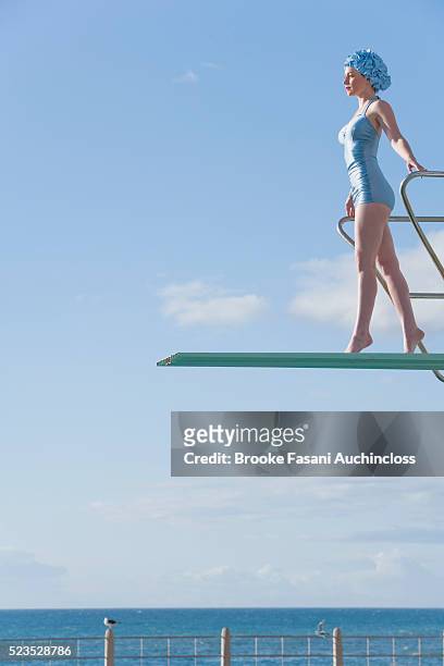 young woman on a high dive - archival imagens e fotografias de stock