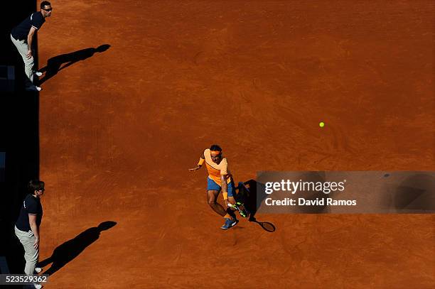 Rafael Nadal of Spain plays a backhand against Philipp Kohlschreiber of Germany during day six of the Barcelona Open Banc Sabadell at the Real Club...