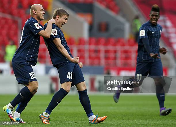 Ruslan Nakhushev , Yevgeni Lutsenko and Thomas Phibel of FC Mordovia Saransk celebrate after scoring a goal during the Russian Premier League match...