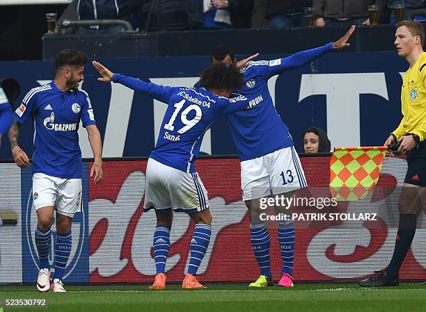 Schalke's Cameroonian forward Eric Maxim Choupo-Moting , Schalke's midfielder Leroy Sane and Schalke's Brazilian defender Junior Caicara celebrate...