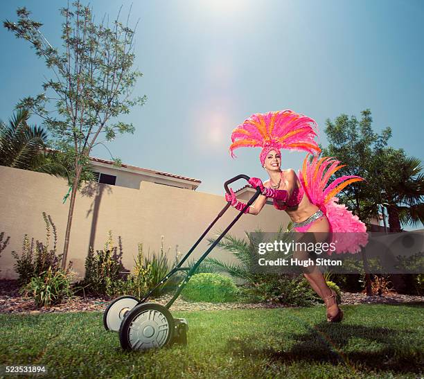 showgirl mowing lawn - show girl stock pictures, royalty-free photos & images