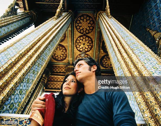 young couple embracing at palace - hugh sitton stock-fotos und bilder