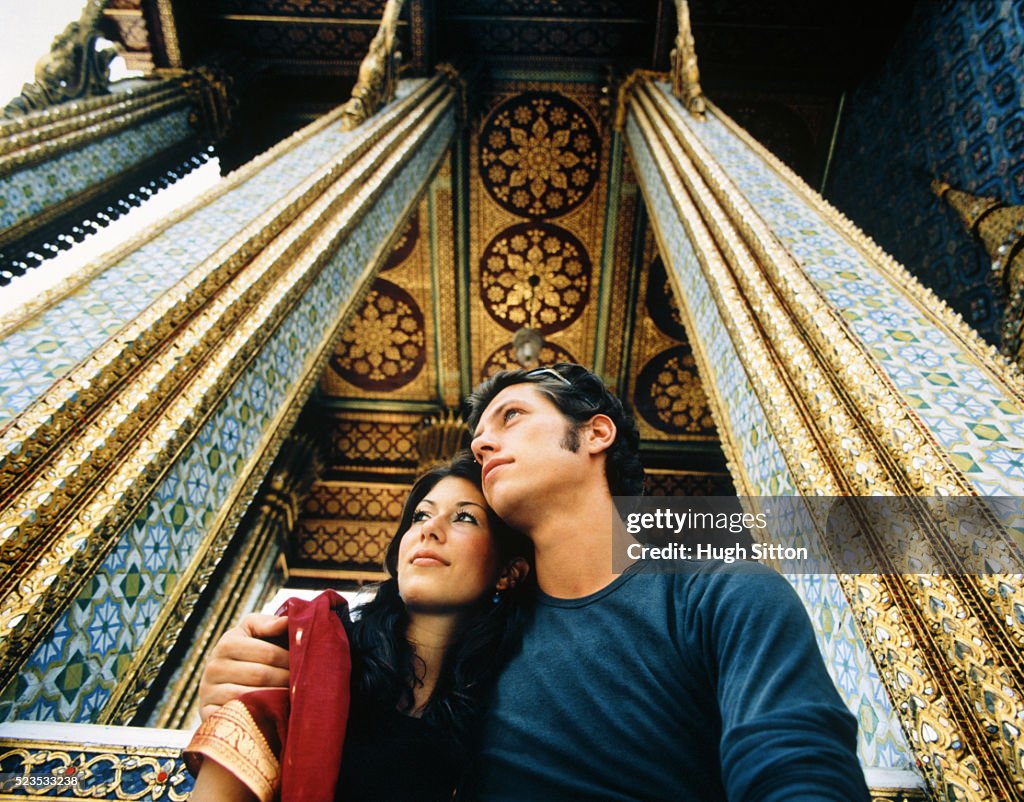 Young Couple Embracing at Palace