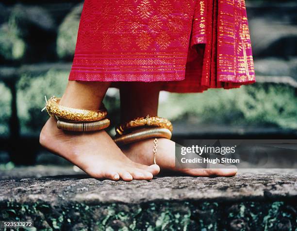 young buddhist woman wearing gold anklets - kambodscha stock-fotos und bilder